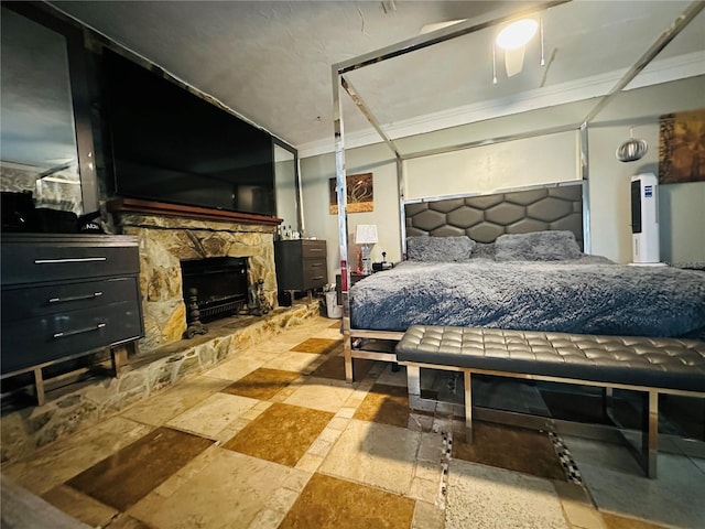 1101 Alcazar Way S, Saint Petersburg, FL 33705 - bedroom featuring stone tile flooring and a fireplace