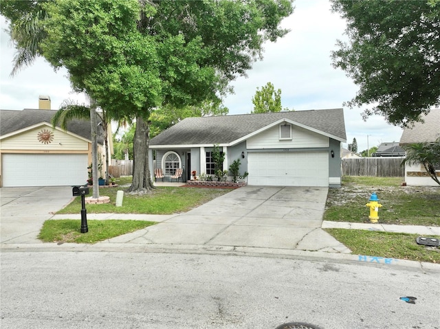 11314 Silverleaf Ct, Riverview, FL 33579 - ranch-style home with driveway, an attached garage, roof with shingles, and stucco siding