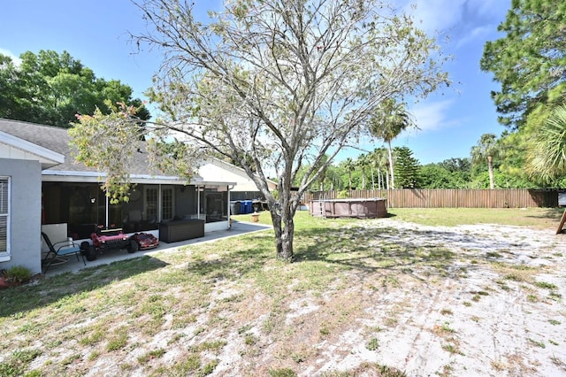 11314 Silverleaf Ct, Riverview, FL 33579 - view of yard featuring a sunroom, a jacuzzi, and a patio area