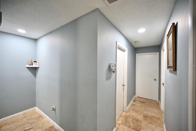 11314 Silverleaf Ct, Riverview, FL 33579 - hallway with a textured ceiling, baseboards, and recessed lighting