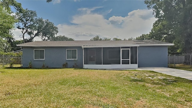 back of house featuring a sunroom, a yard, and fence