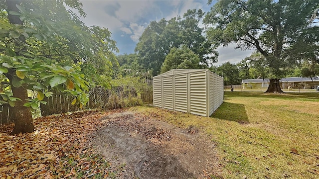 view of shed featuring a fenced backyard