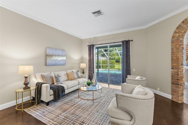 4690 Wrentham Pl, Palm Harbor, FL 34685 - living area featuring arched walkways, wood finished floors, and crown molding