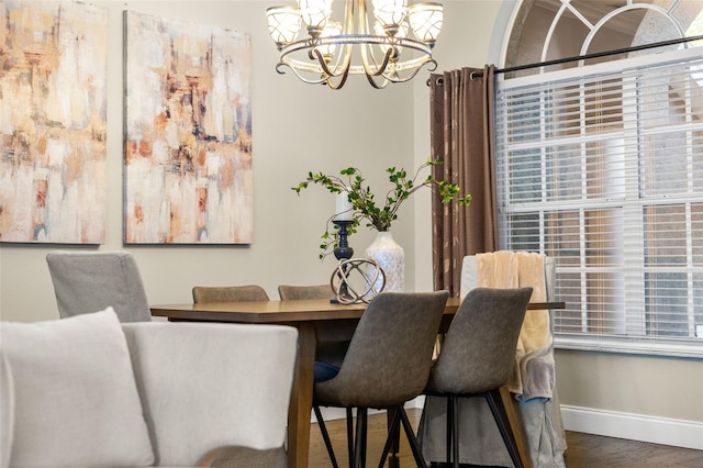 4690 Wrentham Pl, Palm Harbor, FL 34685 - dining room with a chandelier and wood finished floors