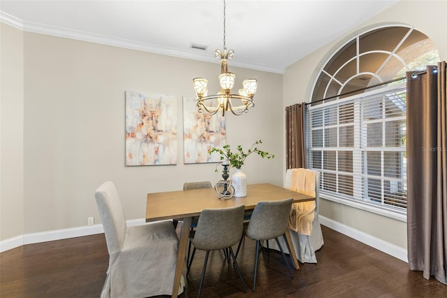 4690 Wrentham Pl, Palm Harbor, FL 34685 - dining room featuring a chandelier, dark wood-style floors, and crown molding