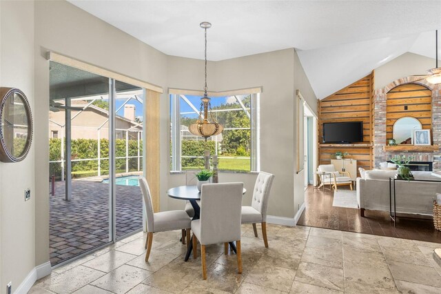 4690 Wrentham Pl, Palm Harbor, FL 34685 - dining room with stone tile flooring and lofted ceiling