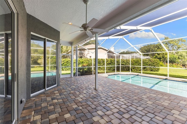4690 Wrentham Pl, Palm Harbor, FL 34685 - outdoor pool with a patio area, a ceiling fan, and glass enclosure