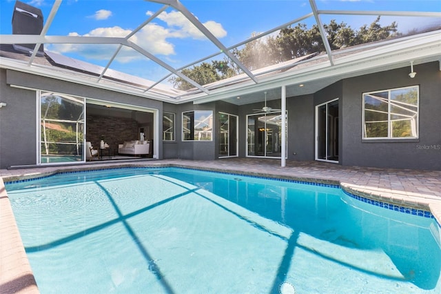 4690 Wrentham Pl, Palm Harbor, FL 34685 - outdoor pool with a patio area, ceiling fan, outdoor lounge area, and glass enclosure