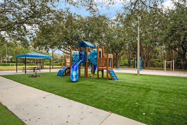 4690 Wrentham Pl, Palm Harbor, FL 34685 - community playground featuring a yard and view of wooded area