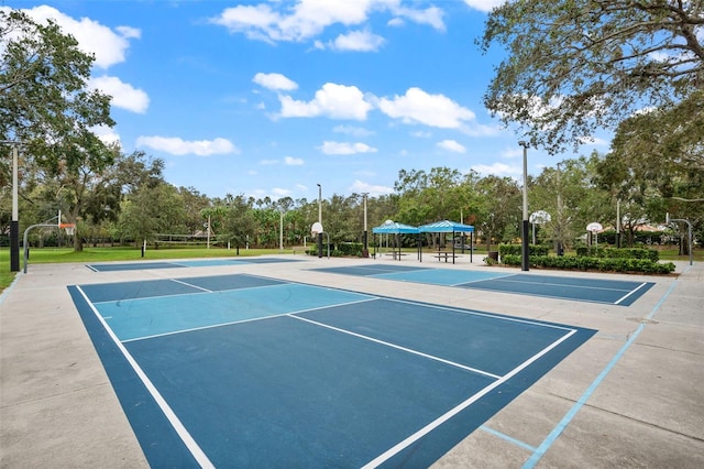4690 Wrentham Pl, Palm Harbor, FL 34685 - view of tennis court with community basketball court and view of wooded area