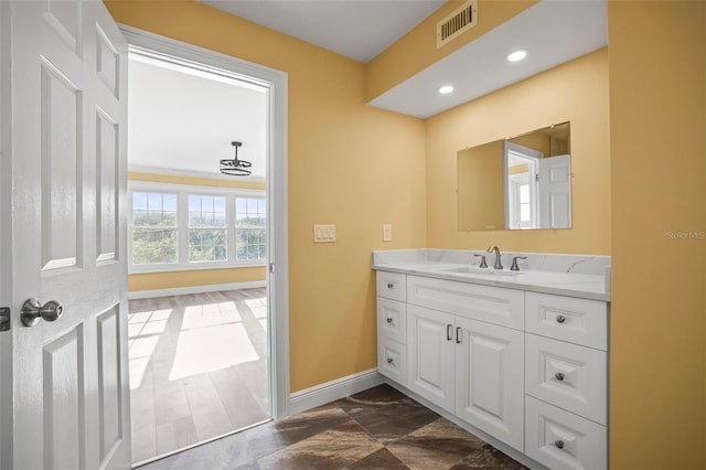 bathroom with visible vents, baseboards, vanity, marble finish floor, and recessed lighting