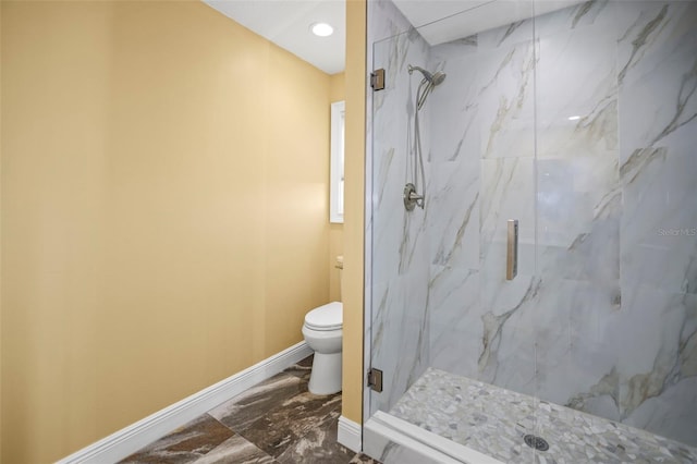 full bath with a marble finish shower, baseboards, toilet, and marble finish floor