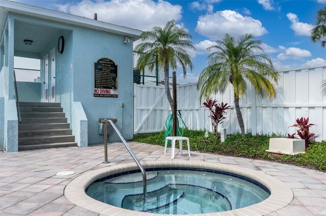 623 Garland Cir, Indian Rocks Beach, FL 33785 - view of pool with a community hot tub and a gate