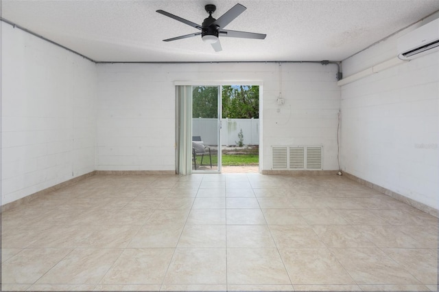 623 Garland Cir, Indian Rocks Beach, FL 33785 - spare room featuring a textured ceiling, ceiling fan, and a wall unit AC