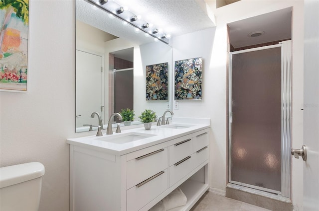 623 Garland Cir, Indian Rocks Beach, FL 33785 - full bathroom with double vanity, toilet, a shower stall, and tile patterned floors