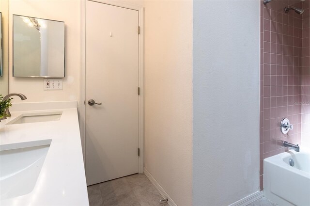 623 Garland Cir, Indian Rocks Beach, FL 33785 - full bath featuring bathtub / shower combination, double vanity, and tile patterned flooring