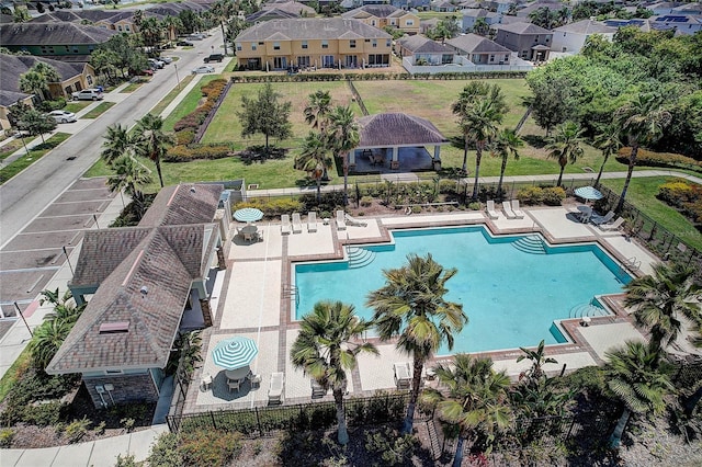 exterior space with a gazebo, fence, a residential view, and a patio area