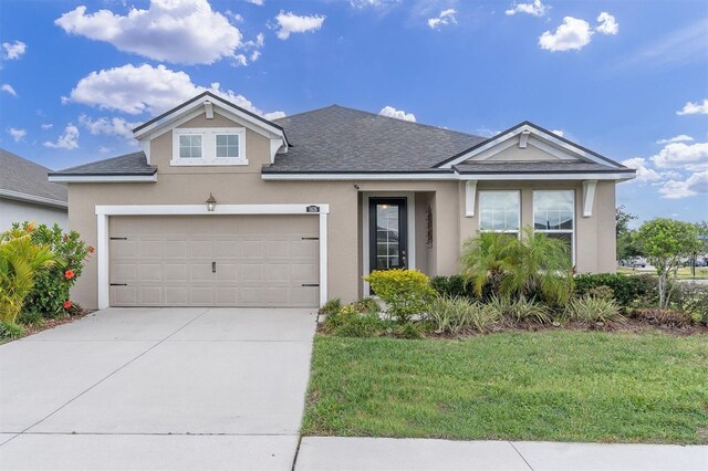 11626 Blue Woods Dr, Riverview, FL 33569 - view of front of house featuring stucco siding, a shingled roof, driveway, and a front yard