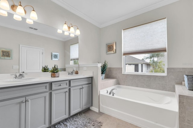 11626 Blue Woods Dr, Riverview, FL 33569 - full bathroom with crown molding, plenty of natural light, a bath, double vanity, and tile patterned floors
