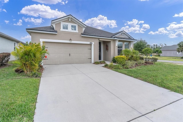11626 Blue Woods Dr, Riverview, FL 33569 - view of front of house featuring stucco siding, a front yard, concrete driveway, and roof with shingles