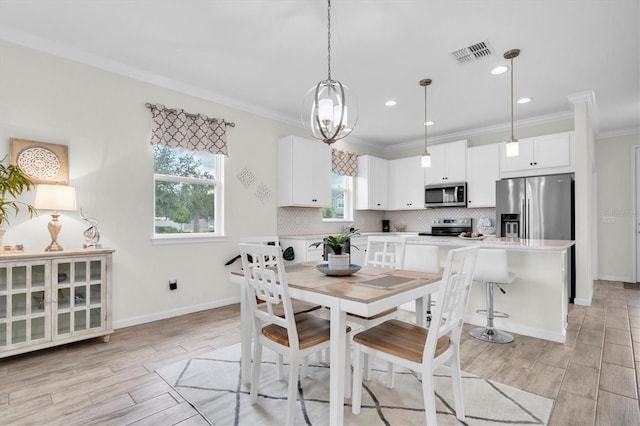11626 Blue Woods Dr, Riverview, FL 33569 - dining space with ornamental molding, light wood-style floors, recessed lighting, and baseboards