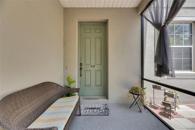 10636 Dawns Light Dr, Riverview, FL 33578 - view of exterior entry with stucco siding and covered porch