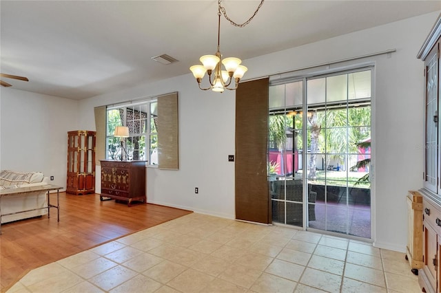 10636 Dawns Light Dr, Riverview, FL 33578 - interior space with a chandelier, access to outside, and baseboards
