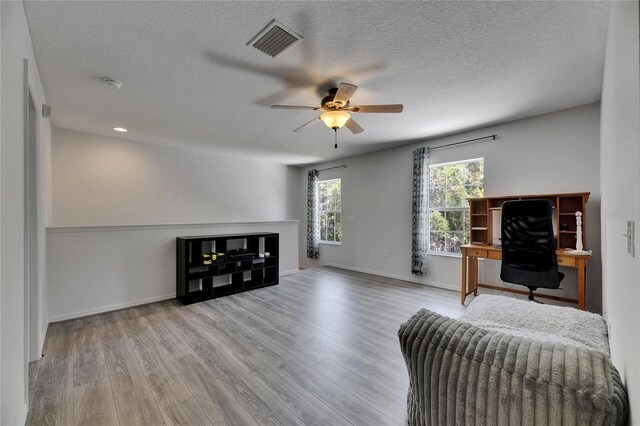 10636 Dawns Light Dr, Riverview, FL 33578 - living area featuring ceiling fan, wood finished floors, a textured ceiling, baseboards, and recessed lighting