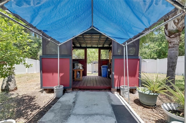 10636 Dawns Light Dr, Riverview, FL 33578 - view of patio with a fenced backyard, a shed, an outbuilding, and a deck