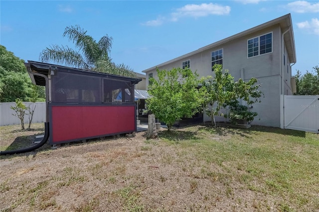 10636 Dawns Light Dr, Riverview, FL 33578 - view of yard with a gate and a sunroom