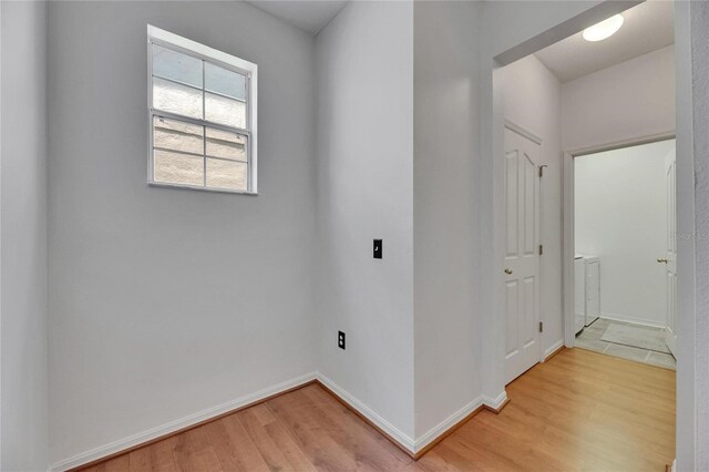 10636 Dawns Light Dr, Riverview, FL 33578 - laundry room featuring light wood-style floors, washer / dryer, and baseboards