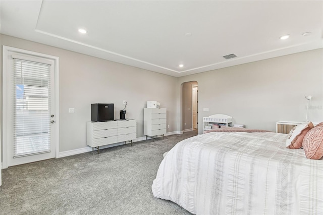 carpeted bedroom featuring arched walkways, baseboards, recessed lighting, and access to exterior