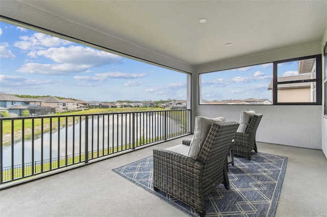 balcony with a water view and a residential view