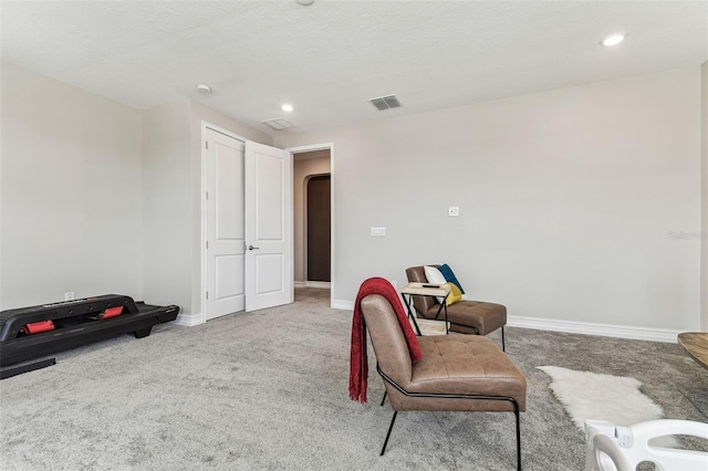 sitting room with carpet flooring, baseboards, and recessed lighting