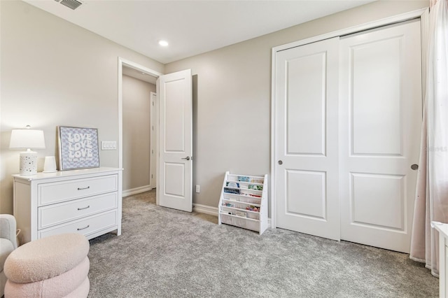carpeted bedroom with a closet, recessed lighting, and baseboards