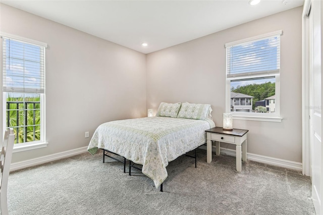 bedroom with multiple windows, carpet flooring, baseboards, and recessed lighting