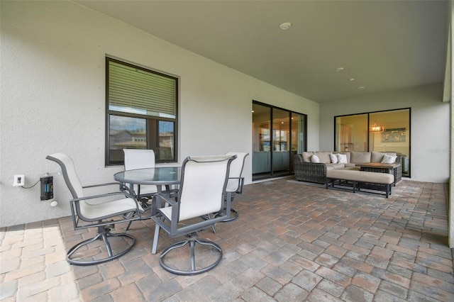 view of patio / terrace with an outdoor hangout area and outdoor dining space