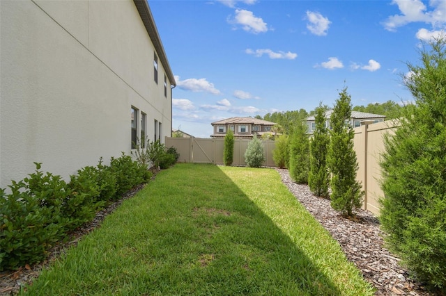 view of yard with a gate