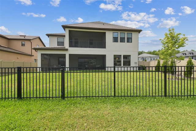 rear view of property with a sunroom and stucco siding