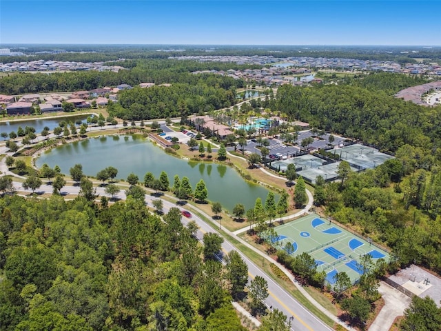 aerial perspective of suburban area with a nearby body of water