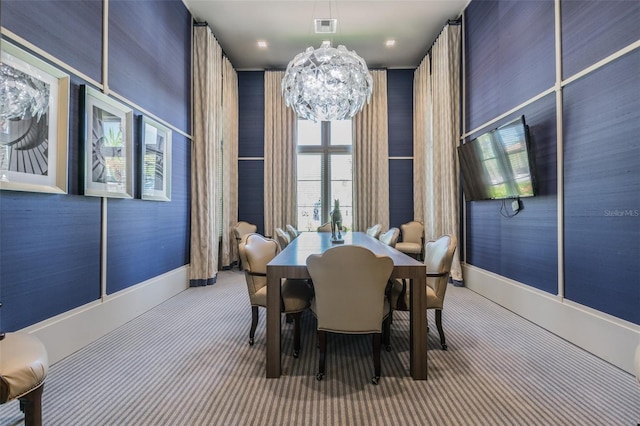 carpeted dining space with baseboards
