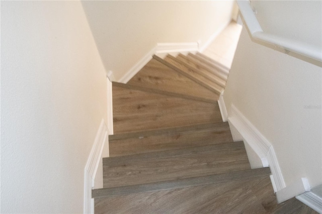 stairs with wood finished floors