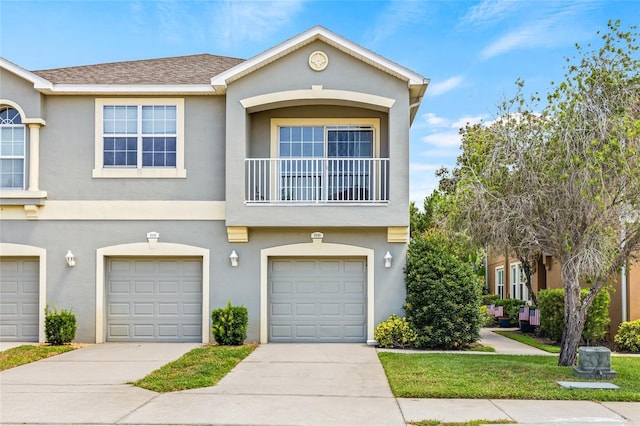 8848 Moonlit Meadows Loop, Riverview, FL 33578 - townhome / multi-family property featuring stucco siding, concrete driveway, and an attached garage