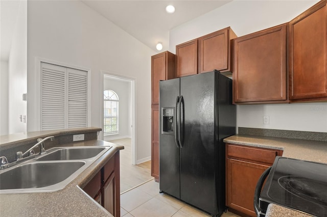8848 Moonlit Meadows Loop, Riverview, FL 33578 - kitchen with black appliances, a sink, light tile patterned floors, recessed lighting, and lofted ceiling