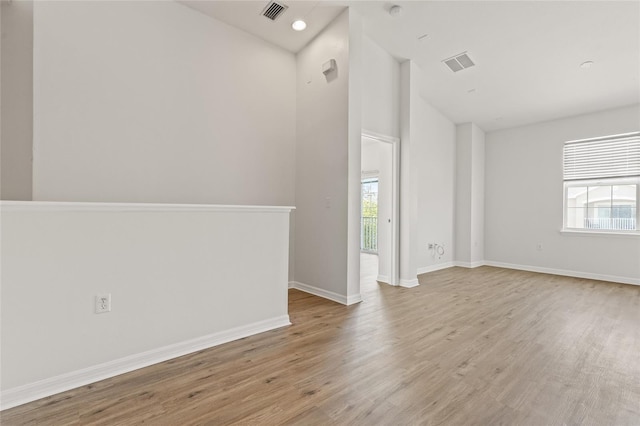 8848 Moonlit Meadows Loop, Riverview, FL 33578 - spare room featuring wood finished floors, high vaulted ceiling, and baseboards
