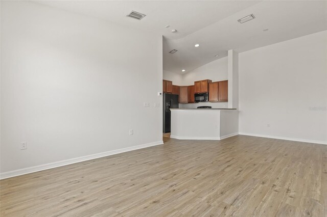 8848 Moonlit Meadows Loop, Riverview, FL 33578 - unfurnished living room featuring light wood finished floors, baseboards, recessed lighting, and high vaulted ceiling