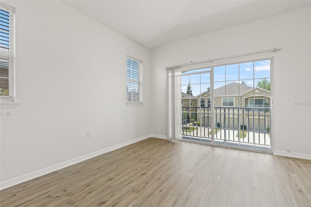 8848 Moonlit Meadows Loop, Riverview, FL 33578 - empty room with wood finished floors and baseboards
