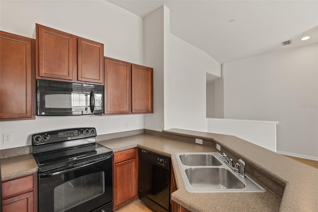 8848 Moonlit Meadows Loop, Riverview, FL 33578 - kitchen featuring black appliances, a sink, a peninsula, brown cabinetry, and recessed lighting