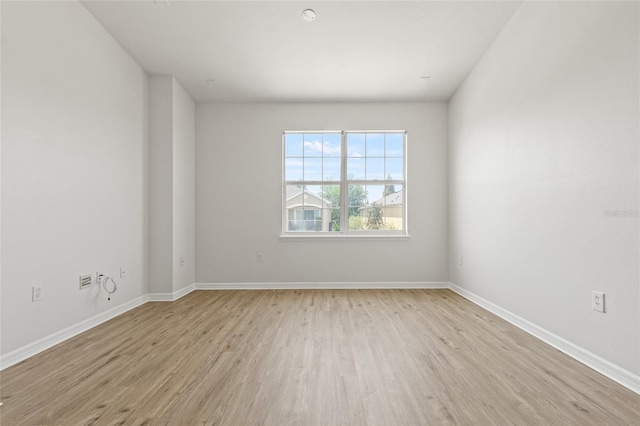8848 Moonlit Meadows Loop, Riverview, FL 33578 - unfurnished room with light wood finished floors and baseboards