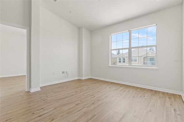 8848 Moonlit Meadows Loop, Riverview, FL 33578 - spare room with light wood finished floors and baseboards